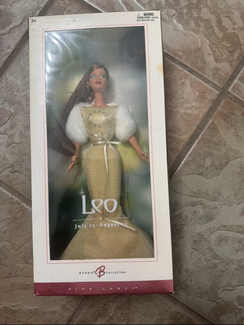 NIB Barbie Gold Leo Zodiac Doll with White Fur Accents